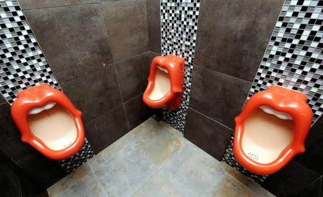 Urinals in the toilets at the "Rosenmeer" restaurant in the western German city of Moenchengladbach are pictured on August 18, 2008. The urinals, in the shape of a mouth, created by Dutch designer Meike van Schijndel, were criticised for being offensive to women. AFP PHOTO DDP / VOLKER HARTMANN GERMANY OUT (Photo credit should read VOLKER HARTMANN/AFP/Getty Images)